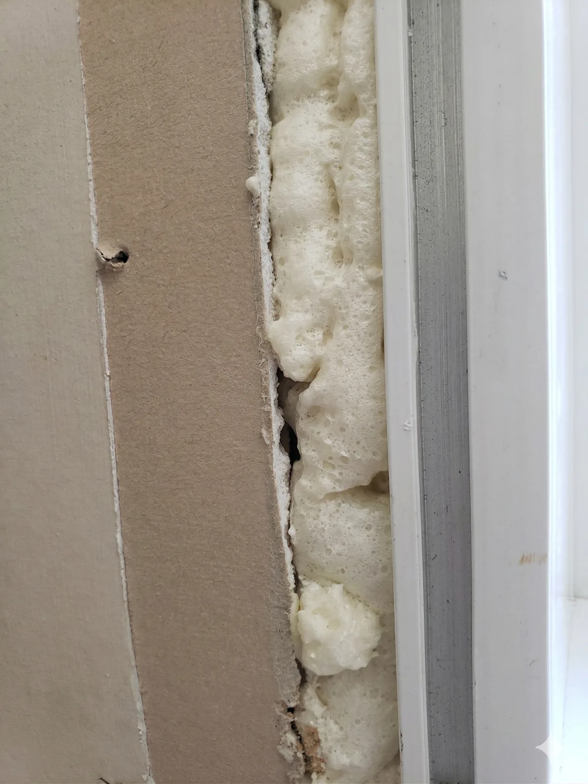 Proper low-expansion foam application around window frame