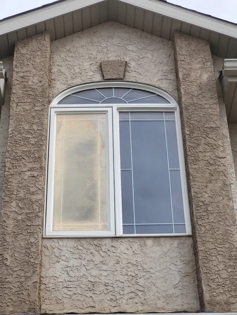 Arched casement window with foggy glass