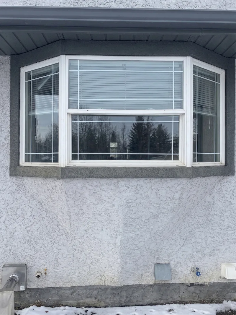 Old bay window with blinds