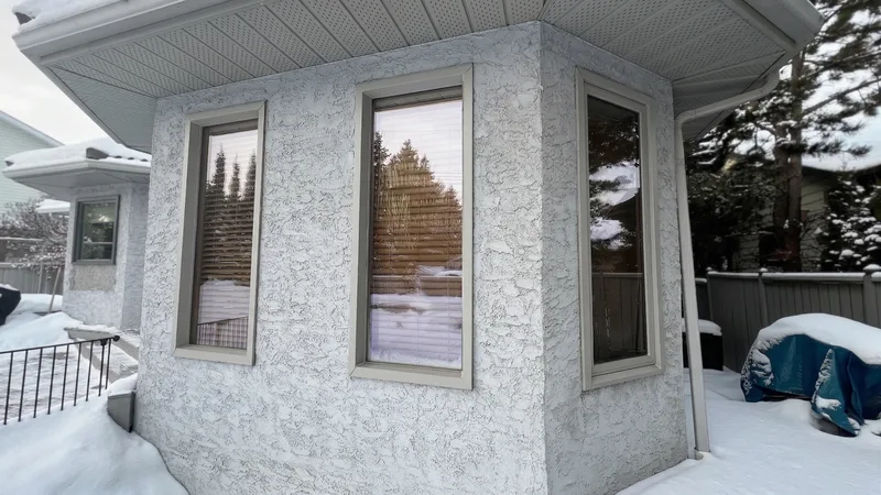 Old corner windows with tan frames